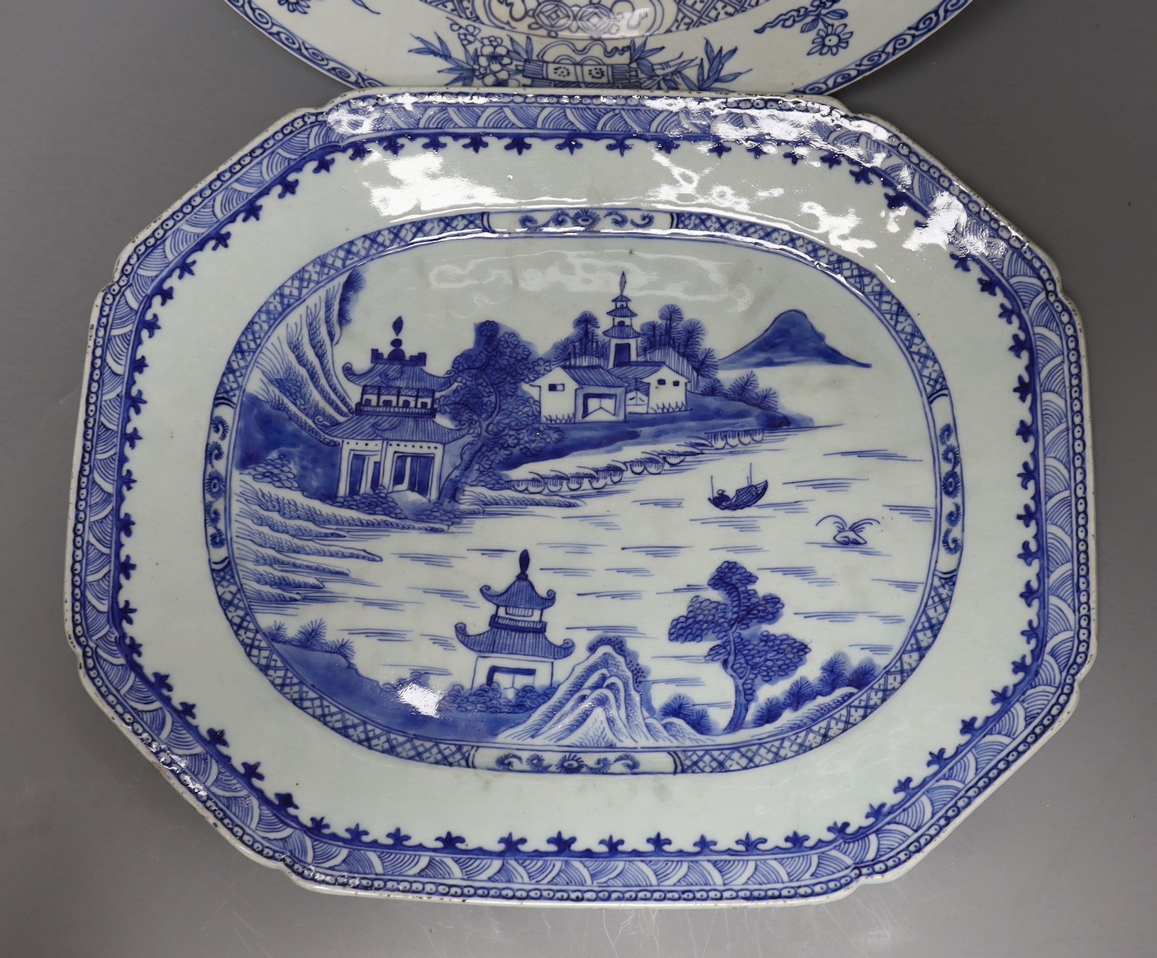 Three Chinese export blue and white dishes, 18th/19th century, largest 42cms wide